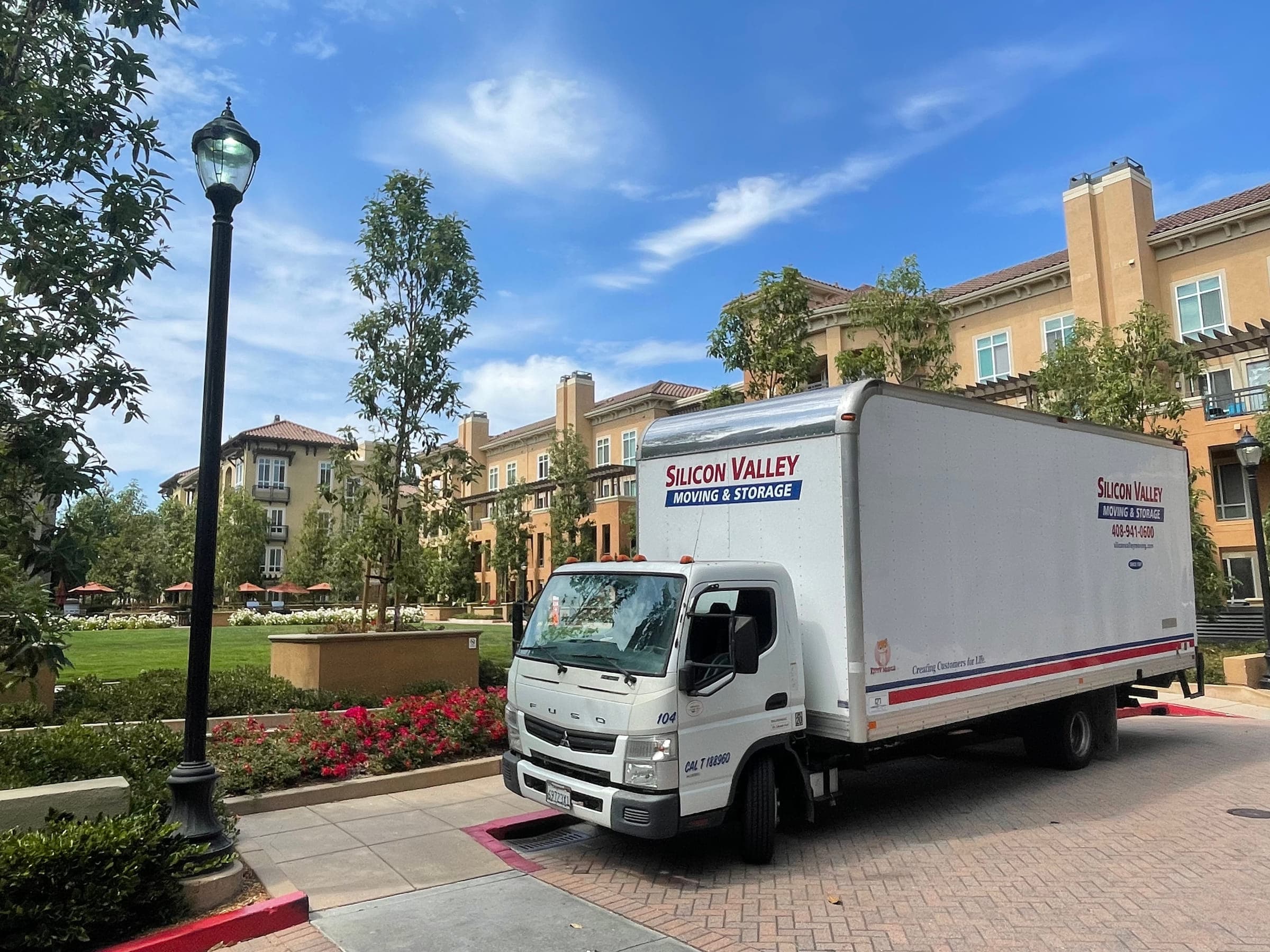 Silicon Valley Moving & Storage truck parked at a Bay Area condominium community for an employee relocation