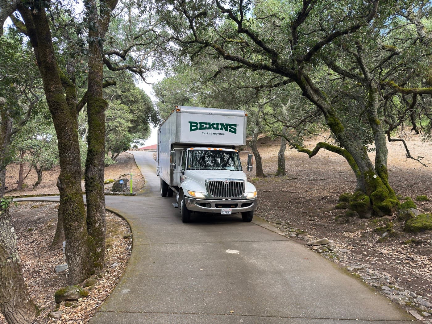 Silicon Valley Moving truck on a tree-lined Bay Area driveway — long-term household storage