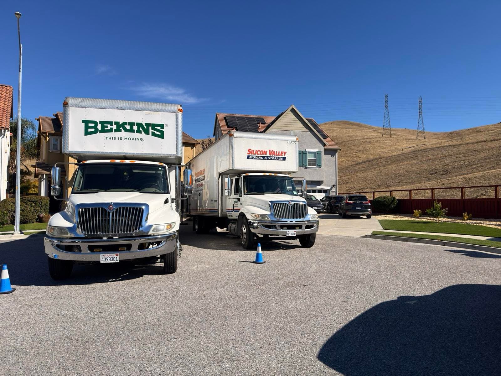 Silicon Valley Moving and Bekins trucks at a Bay Area home